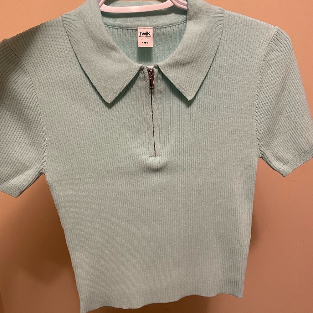 W/tags “twik” Cropped Light blue zippered collared T-shirt